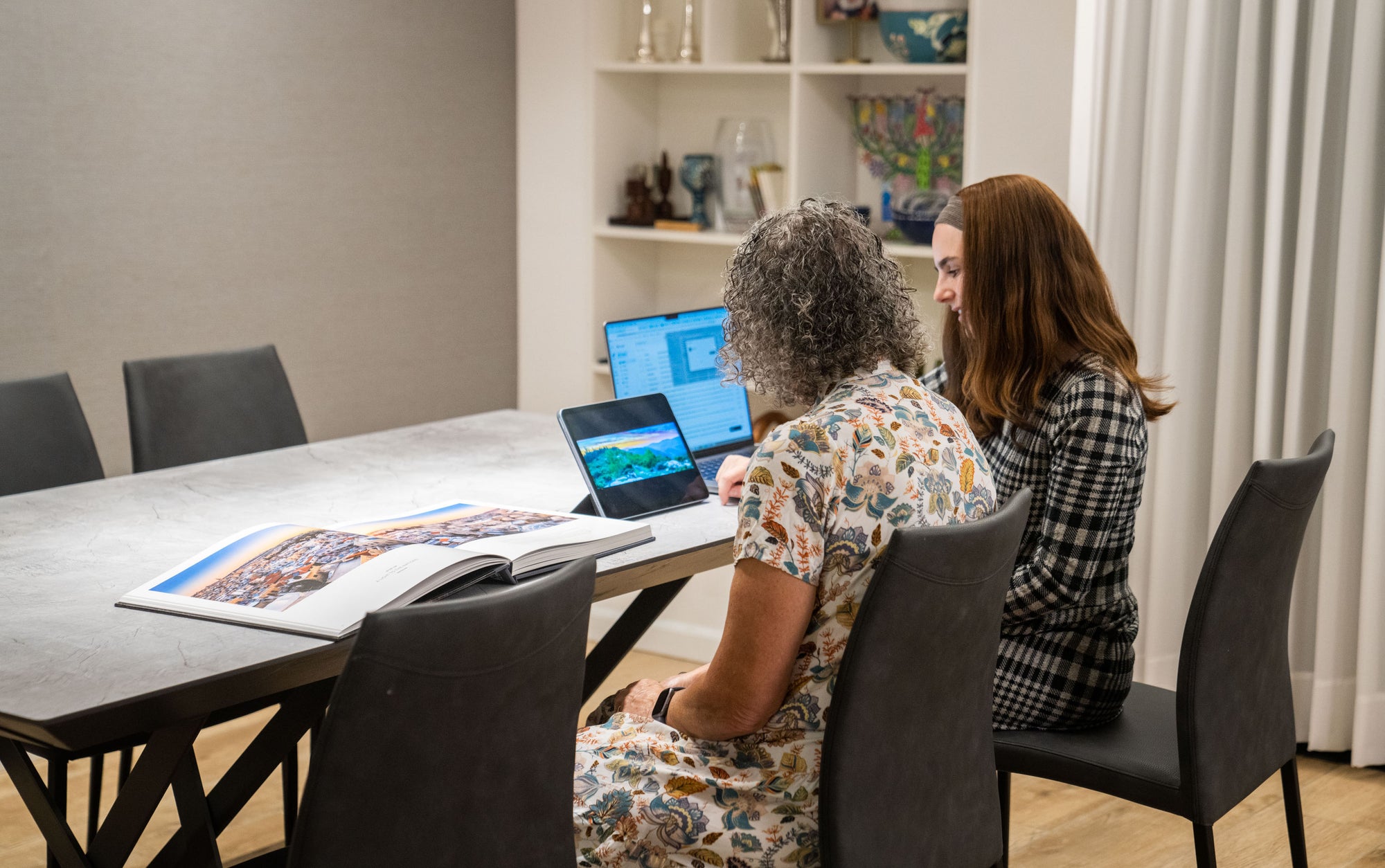 Visitors looking through the collection at the gallery